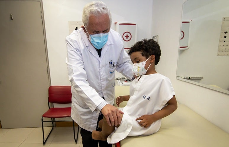 Doctor examining a child.