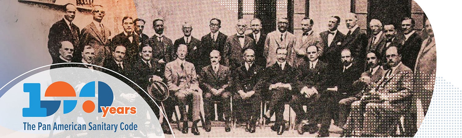 Group of men posing for a photo, wearing early 1900s attire