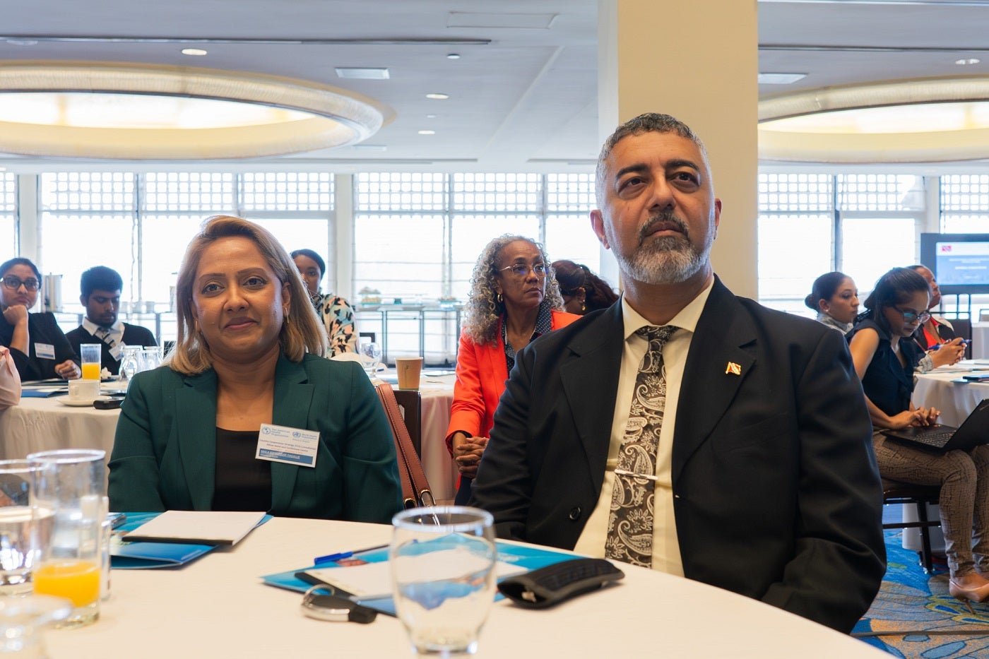 (L_R) Mrs Mala Kowlessar-Tagallie, Legal Advisor and Mr Asif Ali, Permanent Secretary, Ministry of Health listen attentively to a presentation at the TTO CCS Consultation