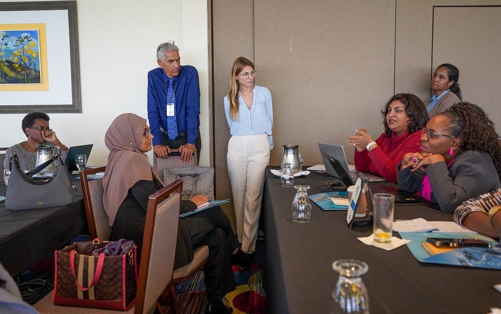  Participants exchange ideas with Mr. Karmesh Sharma - Epidemiologist in the Epidemiology Division, Ministry of Health and Dr. Lidia Redondo Bravo - International PAHO Consultant, Infectious Hazards Management Unit during the productive two-day workshop