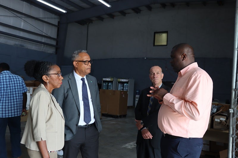 After a tour of the new Supply Management Agency, the warehouse manager explained the logistical strategies and challenges of delivering supplies to the various islands.