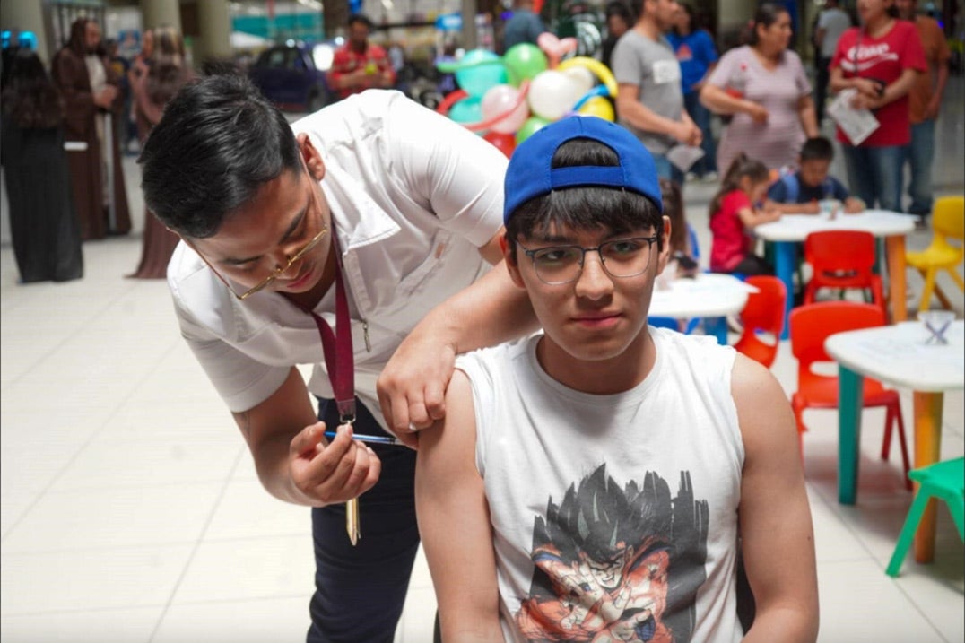 Young man participating in a vaccination campaign in Mexico during Vaccination Week in the Americas 2024