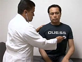 Doctor examines patient in Mexico