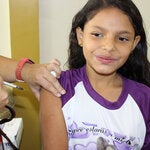 Girl being vaccinated