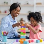 women with children playing