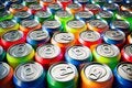 A gruop of aluminium cans of many colors seen from above