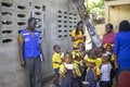 Haiti - Children during vaccination campaign in their community. Girl holding a vaccination card