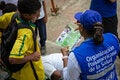 A PAHO female staff has been deployed to rural area. She is sharing health information with an adolescent.