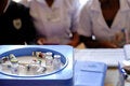 Health workers wait beside vaccine vials - including the malaria, poliomyelitis, tetanus and diphtheria and rotavirus vaccines at Kawale health center in rural Lilongwe, Malawi.