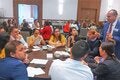 Dr Gabriel Vivas Francesconi, PAHO/WHO Representative for Trinidad and Tobago, Aruba, Curacao, Sint Maarten, Bonaire, St Eustatius and Saba (standing), facilitates one of the working group sessions during the consultation