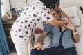 Nurse takes care of patient in hospital setting