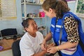 PAHO staff interacts with patient during diabetes screening