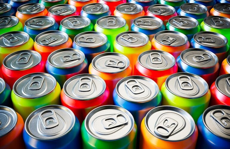 A gruop of aluminium cans of many colors seen from above