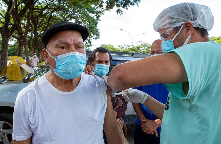 Older person receiving vaccine