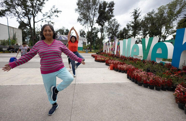 Women of different ages do Tai chi in Meyehualco