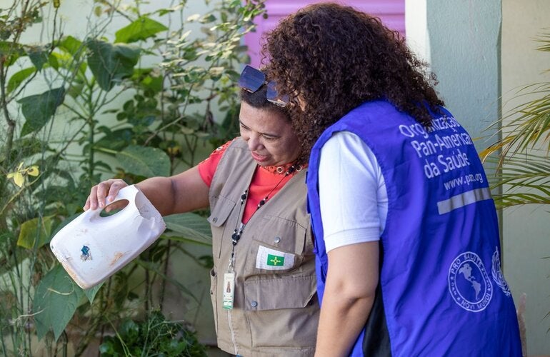 In Brazil, community health workers visit local residents to help find and destroy mosquito breeding sites.