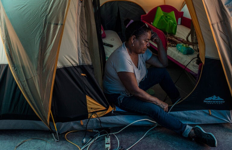 woman in tent after disaster