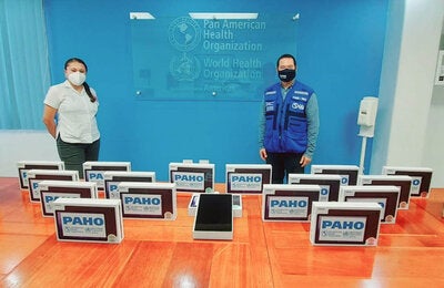 PAHO Belize donate tablets for contact tracers for the MoHW