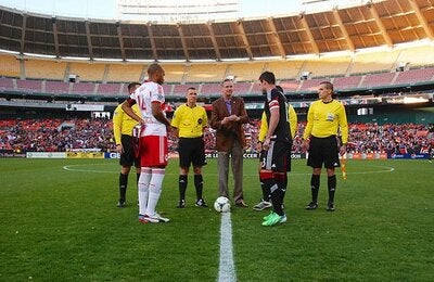 andrus tossing coin at soccer game