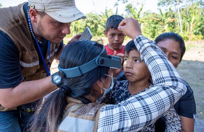 At the home of Demecio Semo, a Yuqui father, the whole family undergoes evaluation.