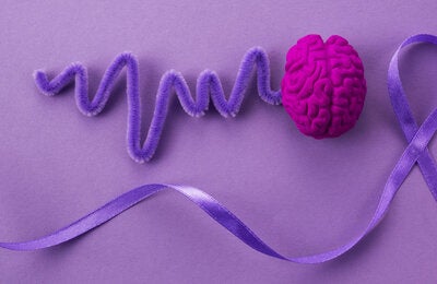 collage of items representing brain and brainwaves and a purple ribbon