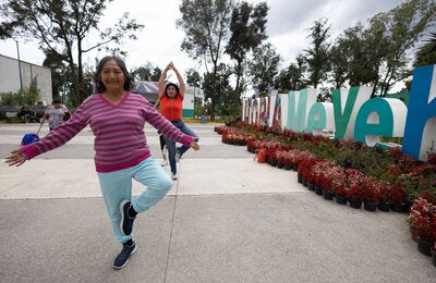 Women of different ages do Tai chi in Meyehualco