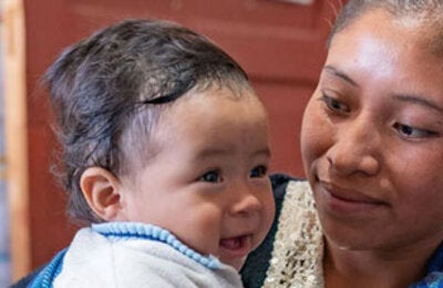 Mother holding child in her arms