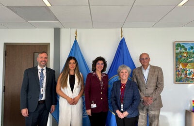 Mary Lou Valdez, PAHO’s Deputy Director, along with Rodrigo Monrroy, Project Management Advisor for PAHO Forward, and Paul de la Croix-Vaubois, Human Resources Advisor, Lita Paparoni, Regional Manager for Latin America and the Caribbean, and other posing for the camera.bbean.