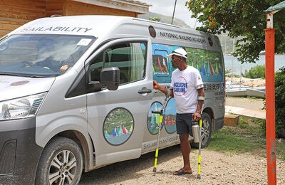 Ronald Greenaway next to the "Sailability" van