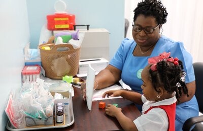 Nurse with little girl