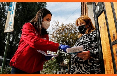  woman-distributing-health-info-2020-1400x700