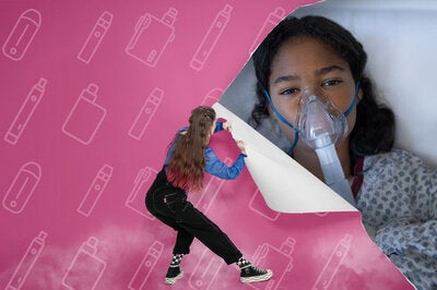 Image of a girl stripping a paper wall, behind which there is a young girl with an oxigen mask on