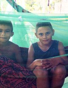 two kids inside netting