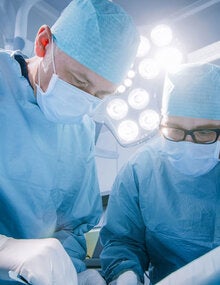 Doctors performing organ transplant