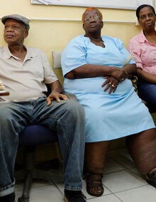 Woman with lymphatic filariasis waits in doctor's office.