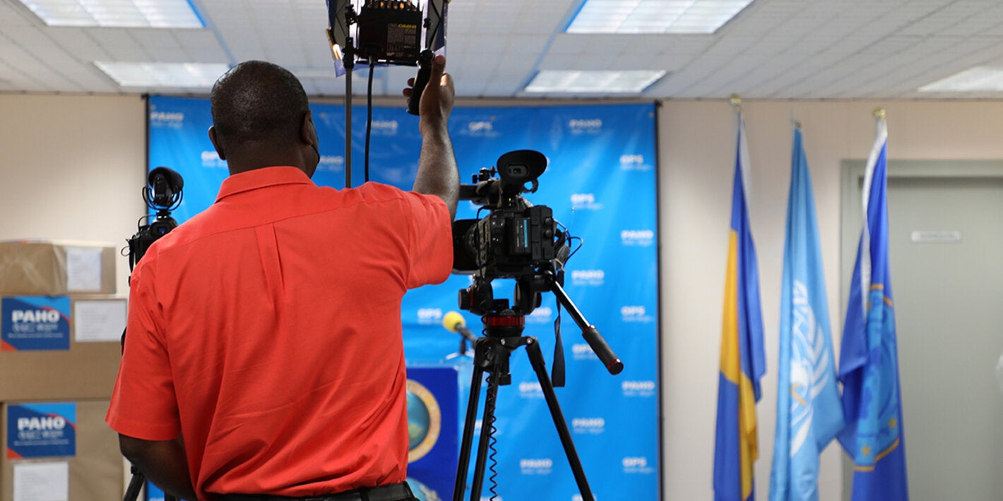 Videographer preparing for briefing