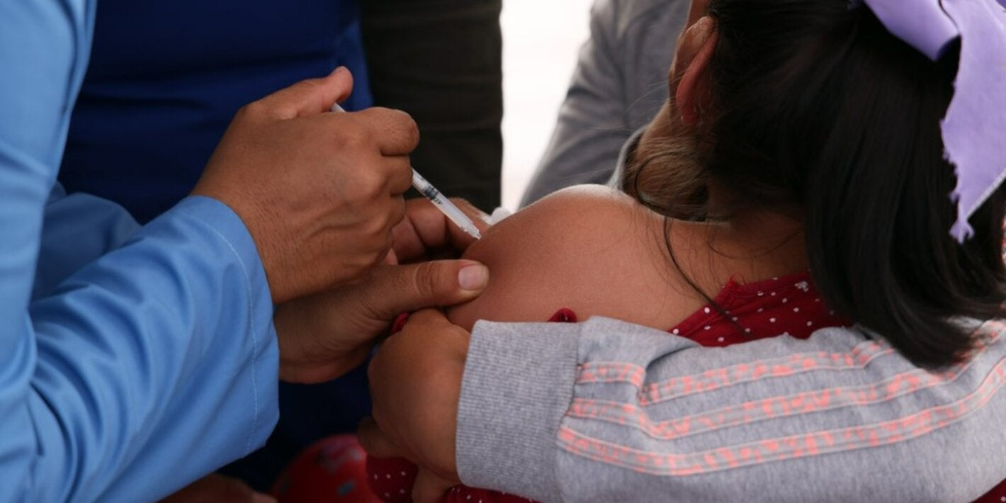 A girl receives a vaccine