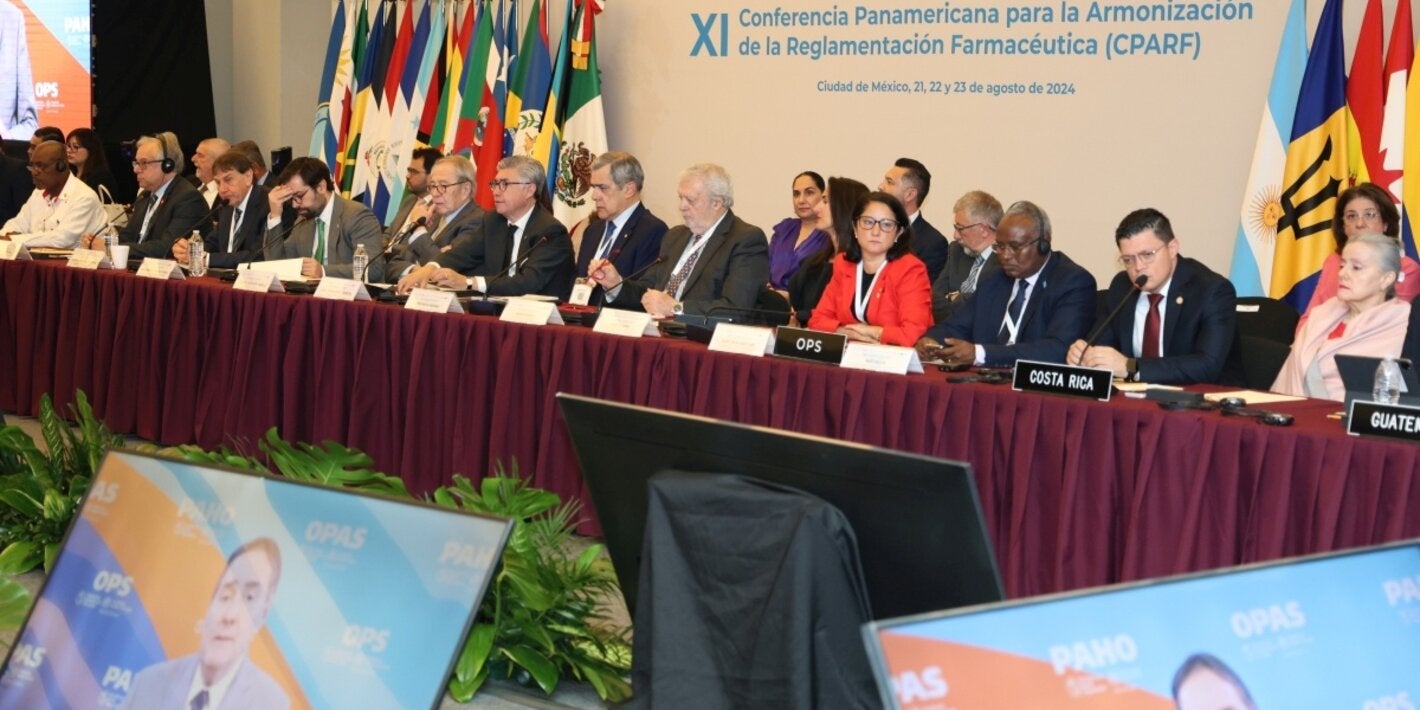 XI Conferencia PARF, foto del presidium mientras se proyecta el video mensaje del Director de OPS