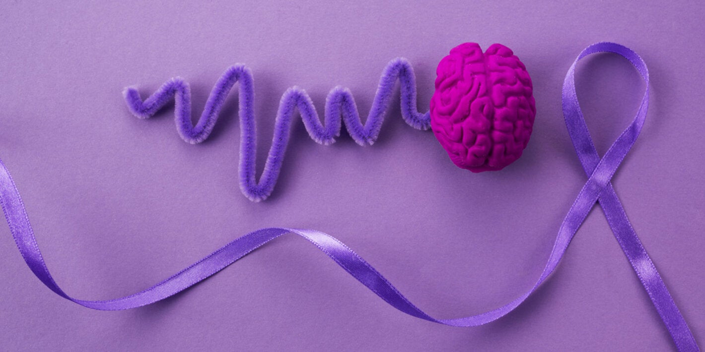 collage of items representing brain and brainwaves and a purple ribbon