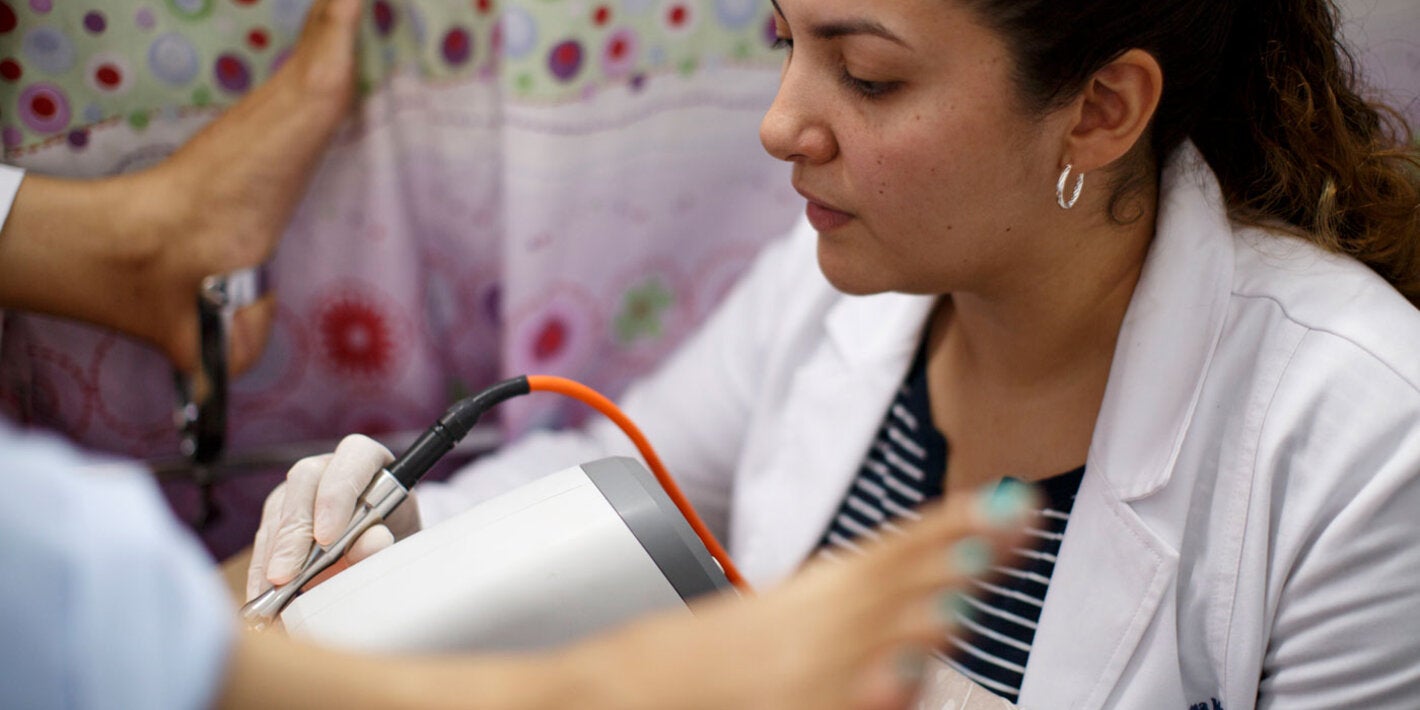 Patient is having an exam by a doctor for HPV