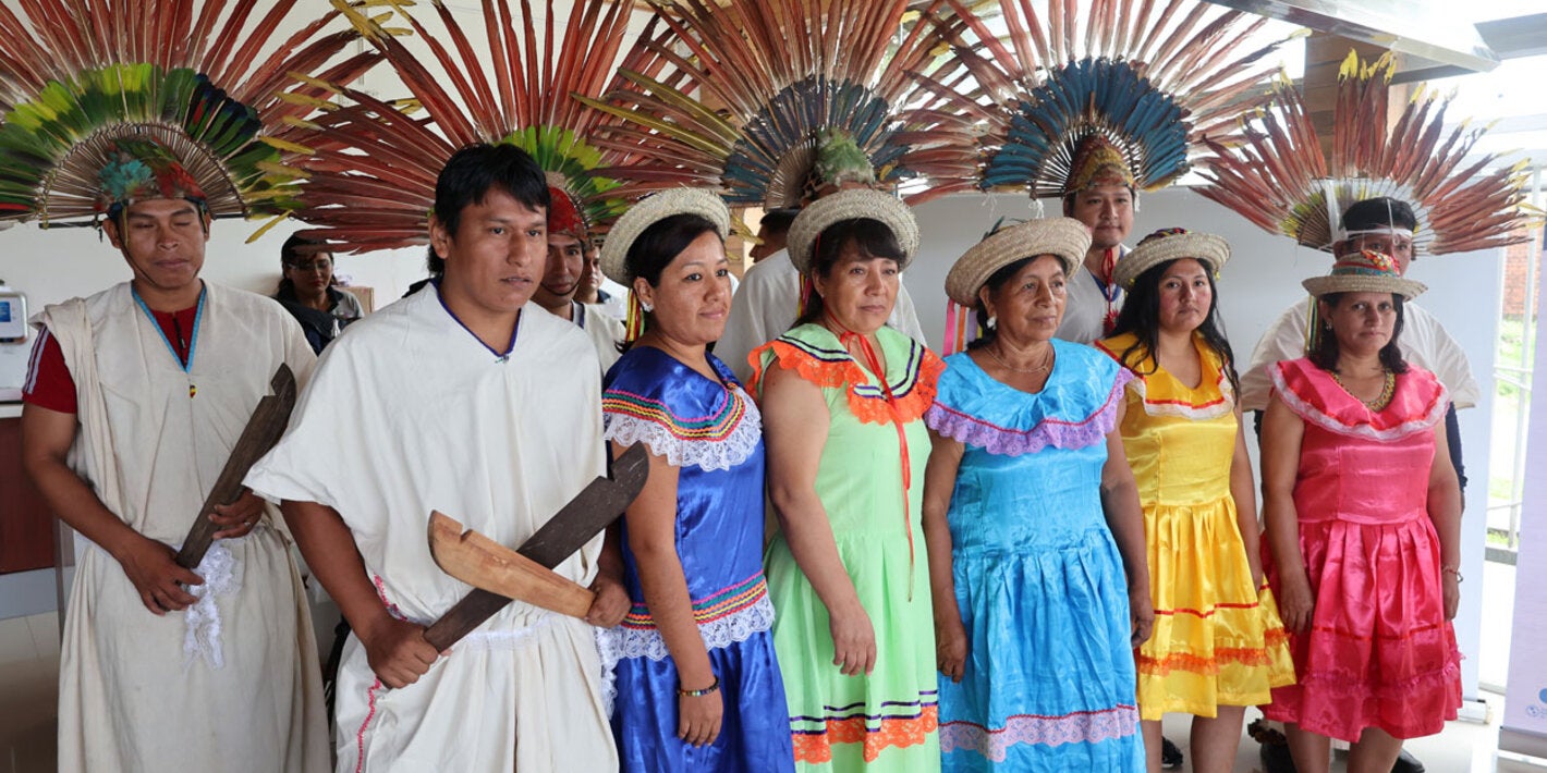 Two men and five women, member of the Information Analysis Committee, Indigenous Network, Cochabamba Tropic region pose for the camera. 