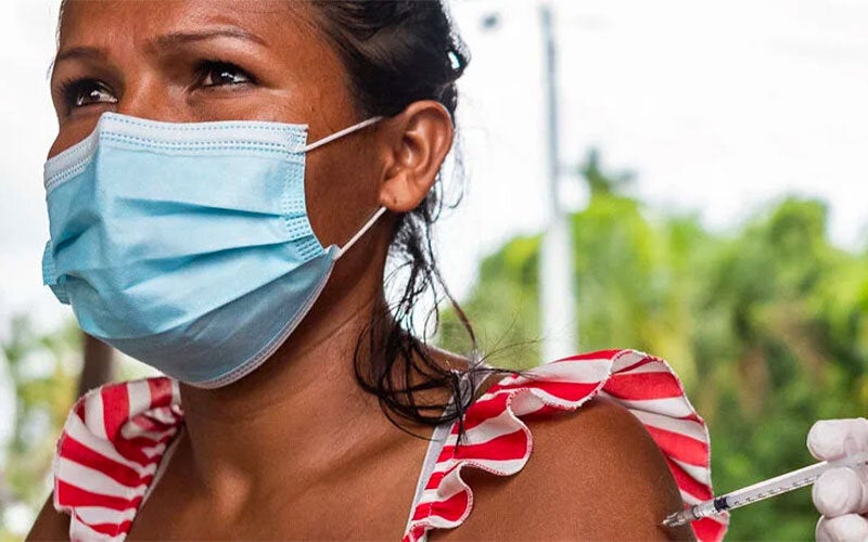Women with face mask during COVID-19 vaccination