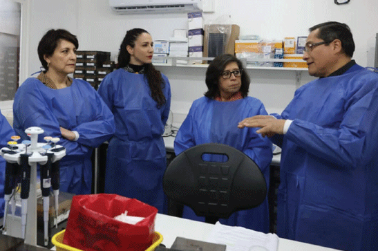 Healthcare workers with lab gowns.