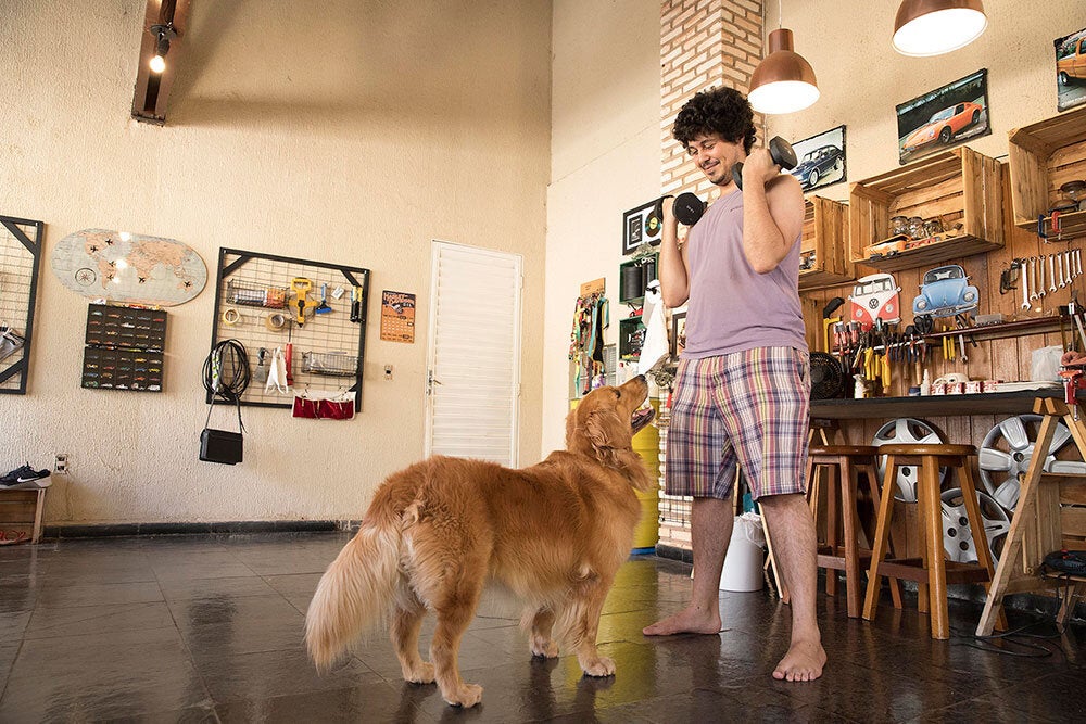 man playing with his dog