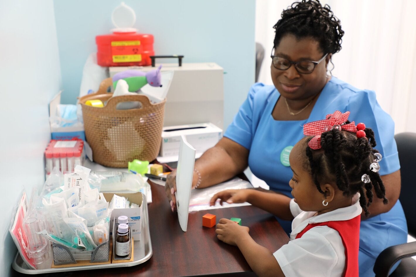 Nurse with little girl