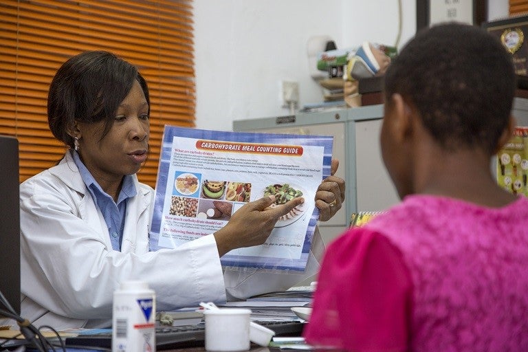 Female health worker providing nutrition counseling to a woman